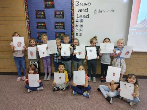 Mrs. Sterner's class with their drawings.