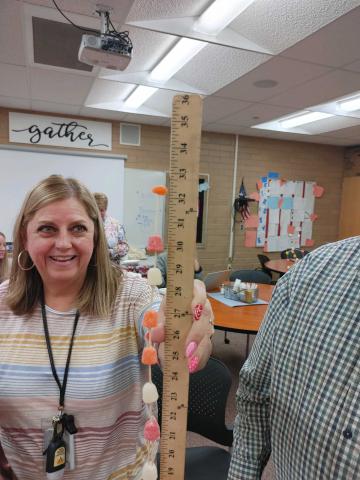 Mrs. Taylor showing the height