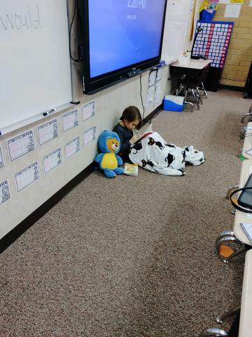 2nd grade student reading quietly