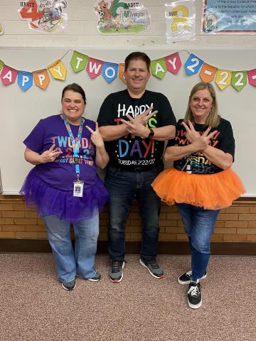 Mrs. Hunt, Mr. Elliott and Mrs. Taylor sporting their twos-day shirts