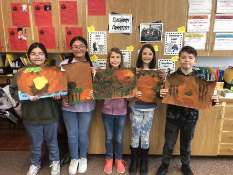 Mrs. Andersen's students with their campfires in a forest artwork