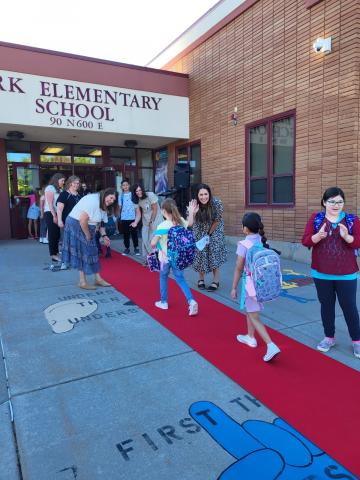 Students walking the red carpet