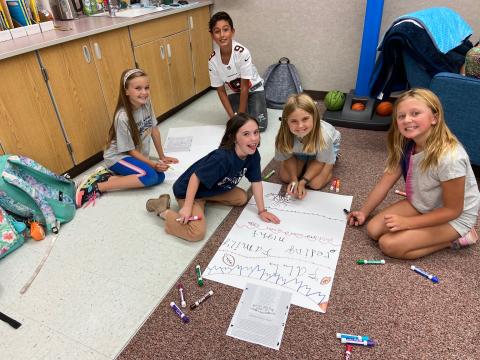 Students creating posters
