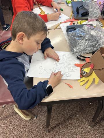 1st grader drawing his turkey picture