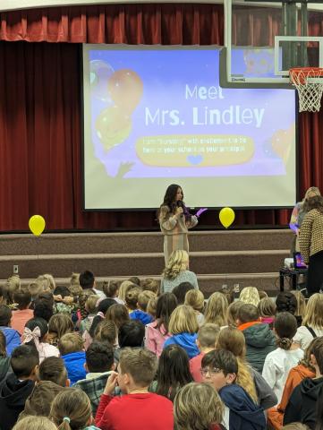 Mrs. Lindley leading the assembly