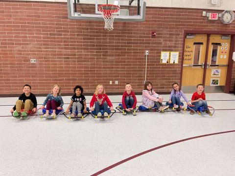 1st graders on the scooter chairs