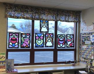 Stained glass art hanging in classroom window