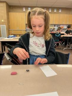 Playing with paperclips and magnets.