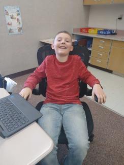 Conner in Mrs. Hughes' chair